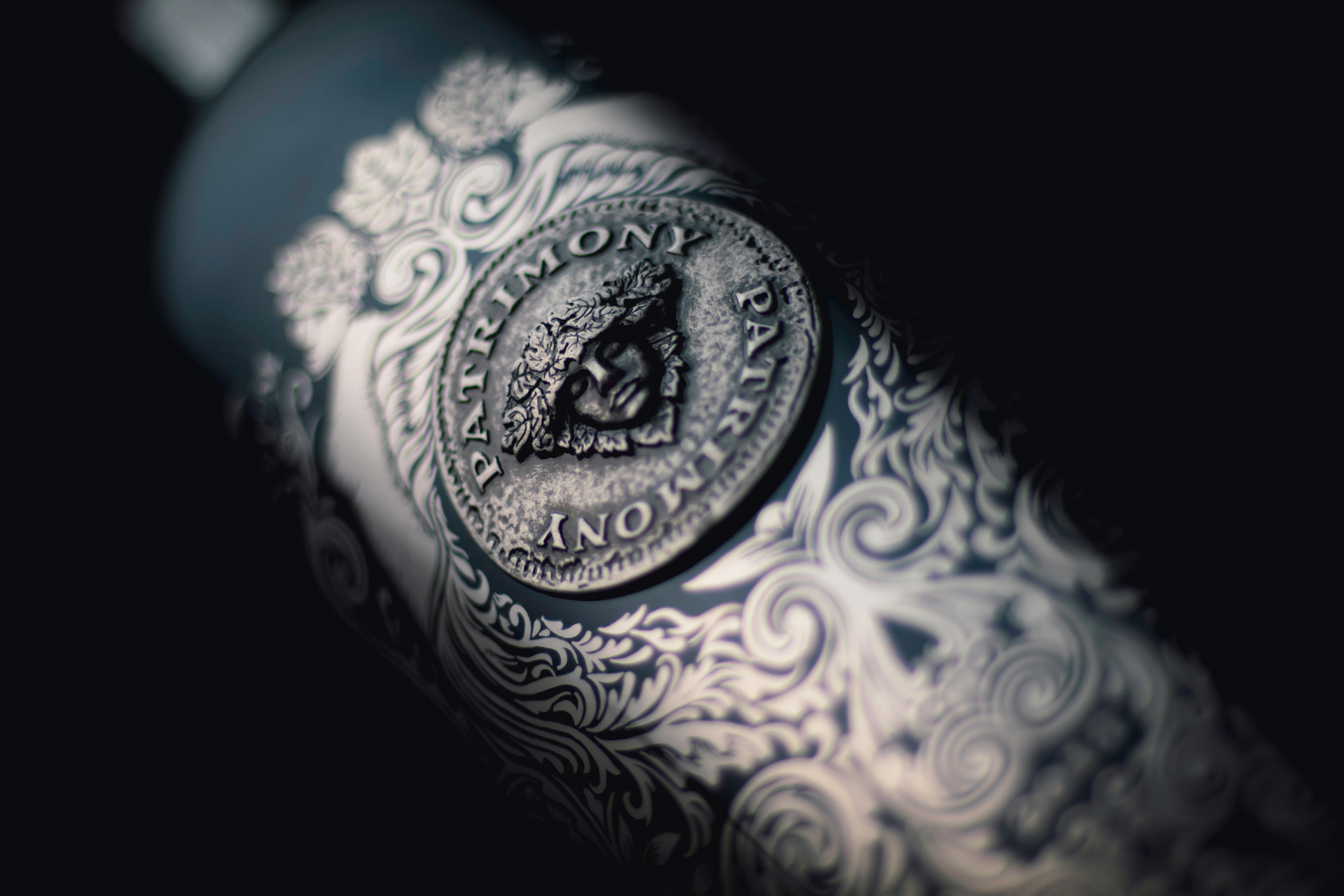 Ornate engraved wine bottle detail